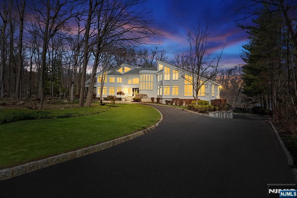 a view of a house with a garden and pathway