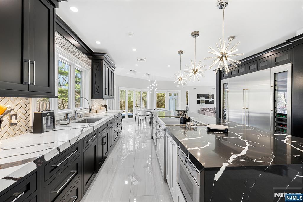 817 West Shore Drive Butler, NJ 07405 - Photo 11 of 50 a kitchen with stainless steel appliances granite countertop a sink stove and refrigerator