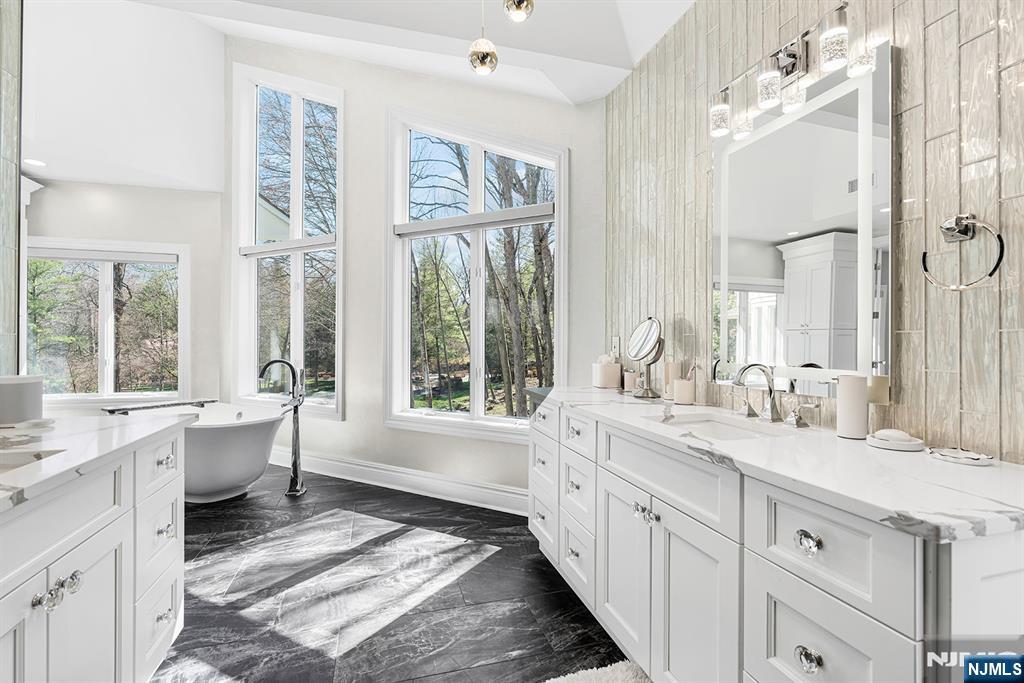 817 West Shore Drive Butler, NJ 07405 - Photo 25 of 50 a large white bathroom with a large window sink and double vanity