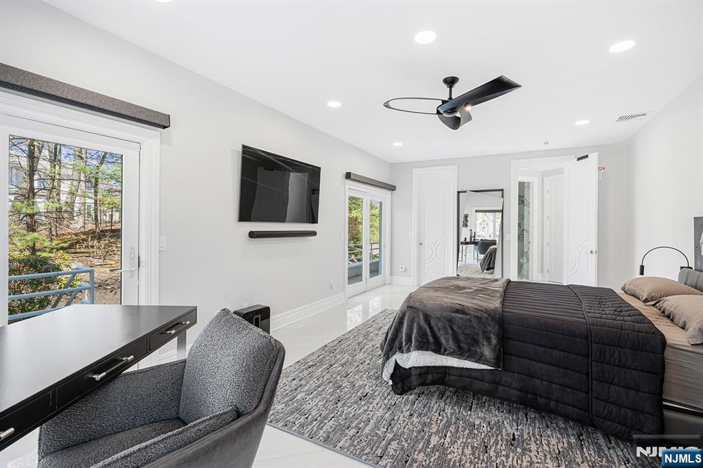 817 West Shore Drive Butler, NJ 07405 - Photo 29 of 50 a living room with a bed furniture and a flat screen tv