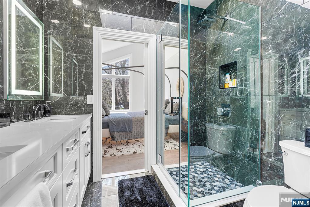 817 West Shore Drive Butler, NJ 07405 - Photo 30 of 50 a bathroom with a bathtub and a shower