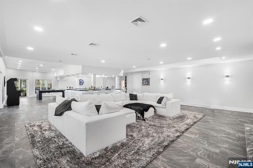 817 West Shore Drive Butler, NJ 07405 - Photo 33 of 50 a living room with furniture and a view of kitchen