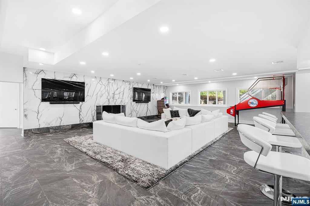 817 West Shore Drive Butler, NJ 07405 - Photo 35 of 50 a living room with furniture and a flat screen tv