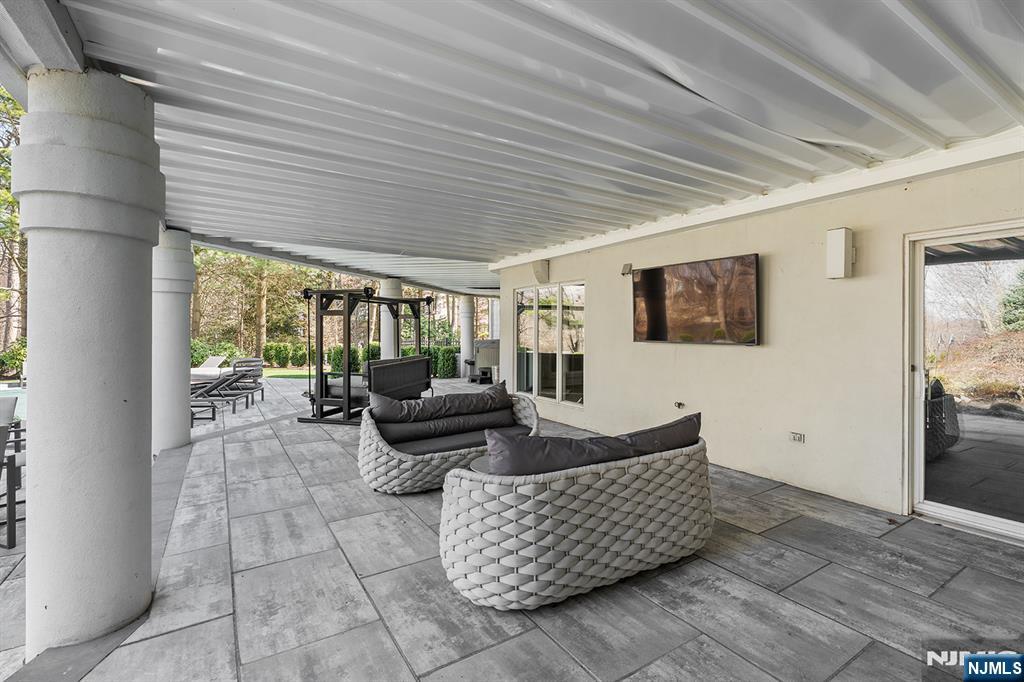 817 West Shore Drive Butler, NJ 07405 - Photo 39 of 50 a living room with furniture and a floor to ceiling window