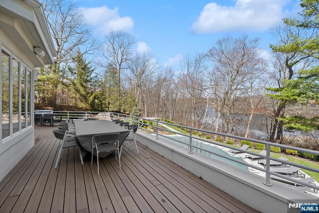 817 West Shore Drive Butler, NJ 07405 - Photo 44 of 50 a balcony with wooden floor table and chairs