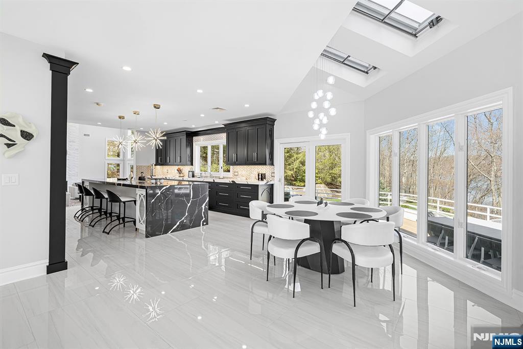 817 West Shore Drive Butler, NJ 07405 - Photo 8 of 50 a large kitchen with a table and chairs