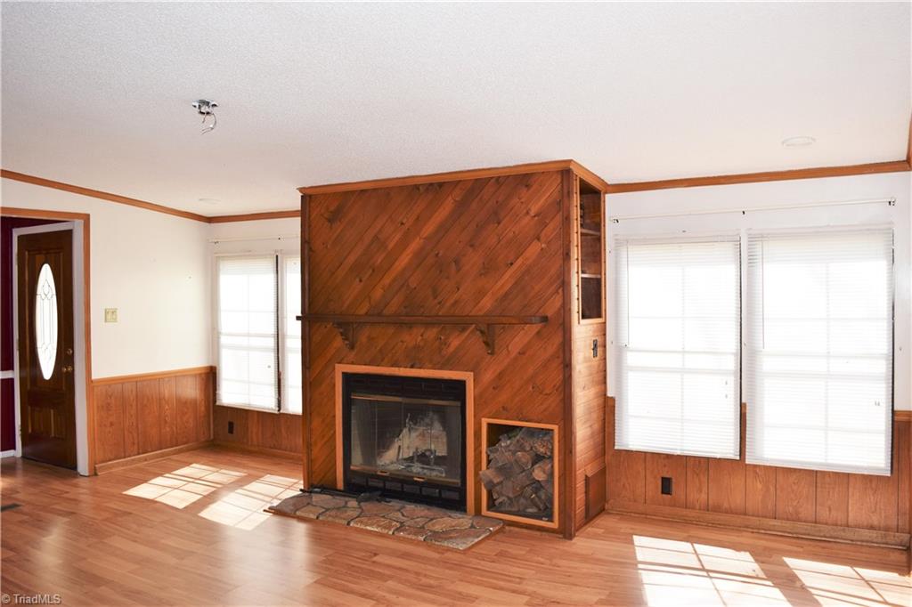 739 Simpson Road Stokesdale, NC 27357 - Photo 3 of 28 Living room with wood burning fireplace