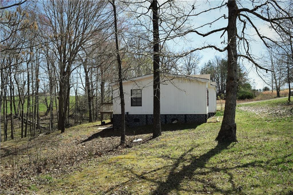 739 Simpson Road Stokesdale, NC 27357 - Photo 24 of 28 Exterior side view and yard