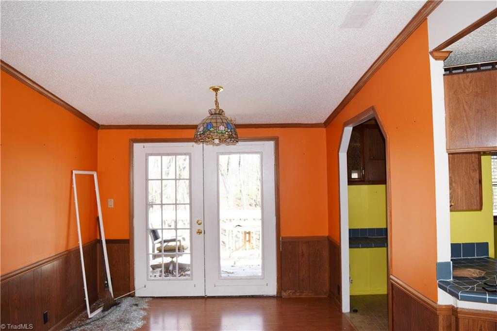 739 Simpson Road Stokesdale, NC 27357 - Photo 9 of 28 Dining room with door to deck