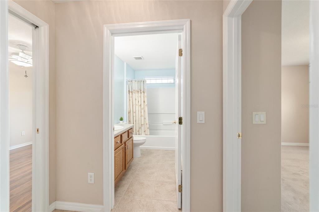 16369 Southwest 14th Avenue Road Ocala, FL 34473 - Photo 32 of 49 a bathroom with a double vanity sink and a mirror