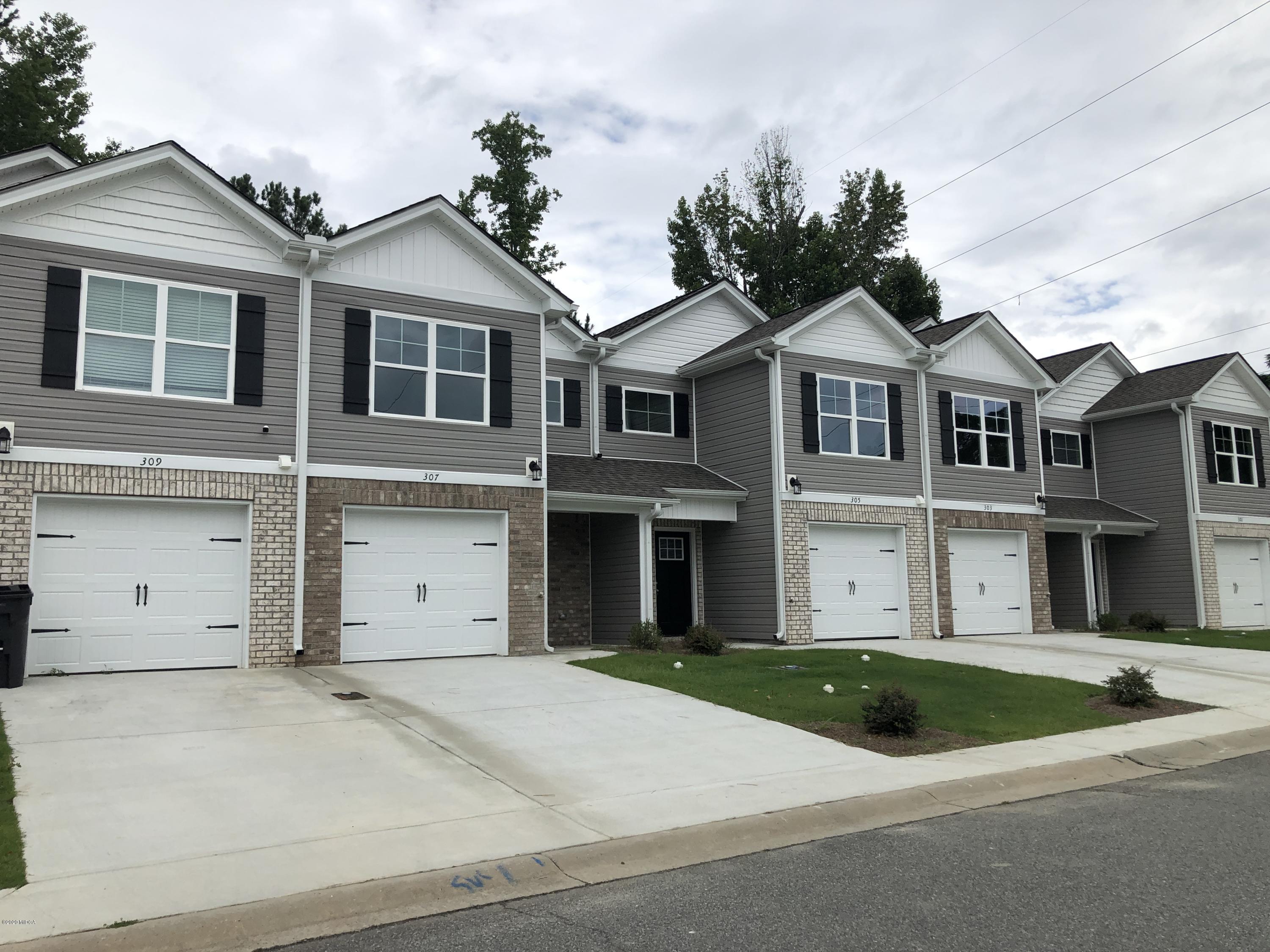303 Pond View Road Macon, GA 31206 - Photo 2 of 33 a view of a white house with a large windows