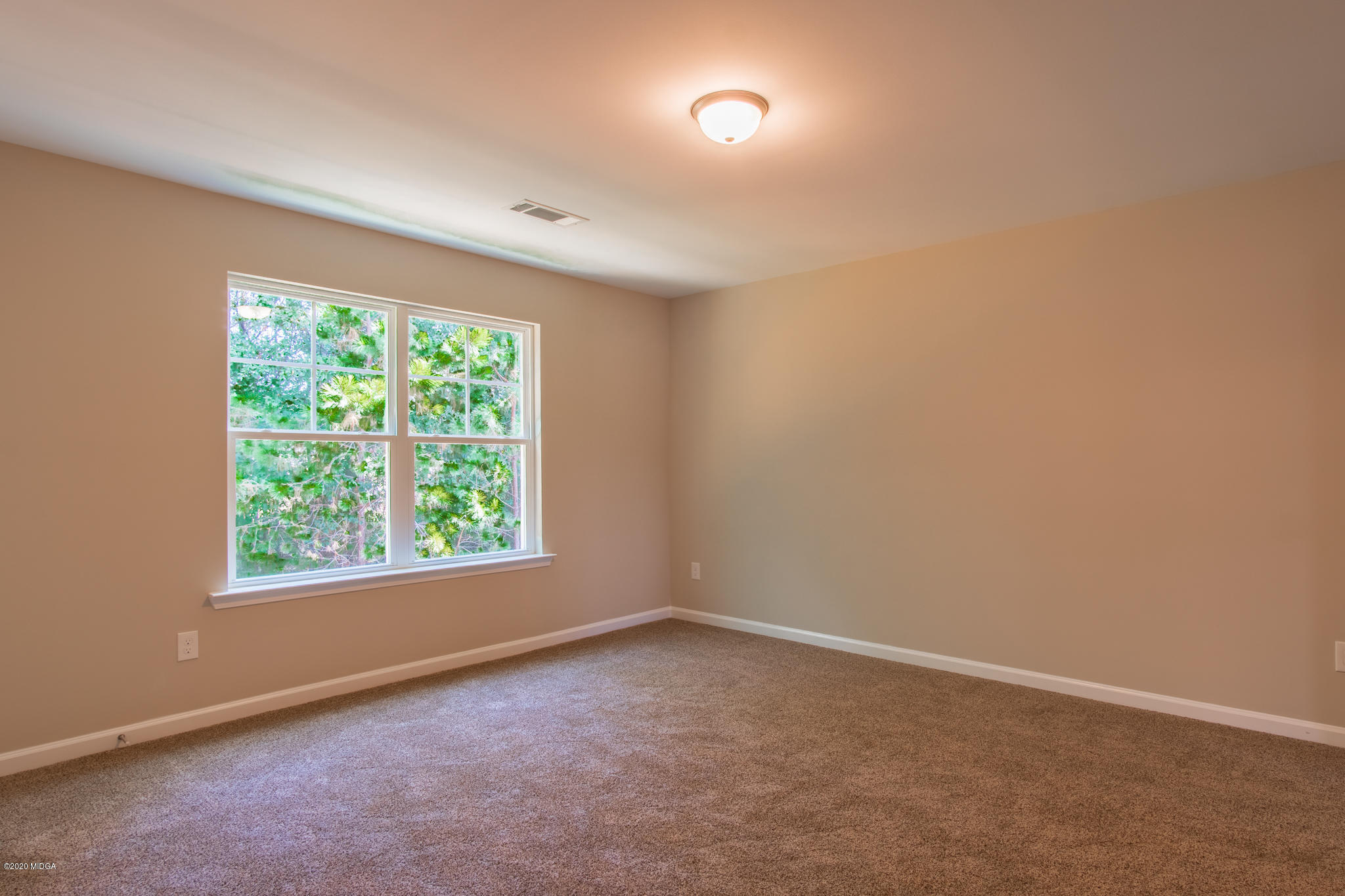 303 Pond View Road Macon, GA 31206 - Photo 14 of 33 an empty room with a window