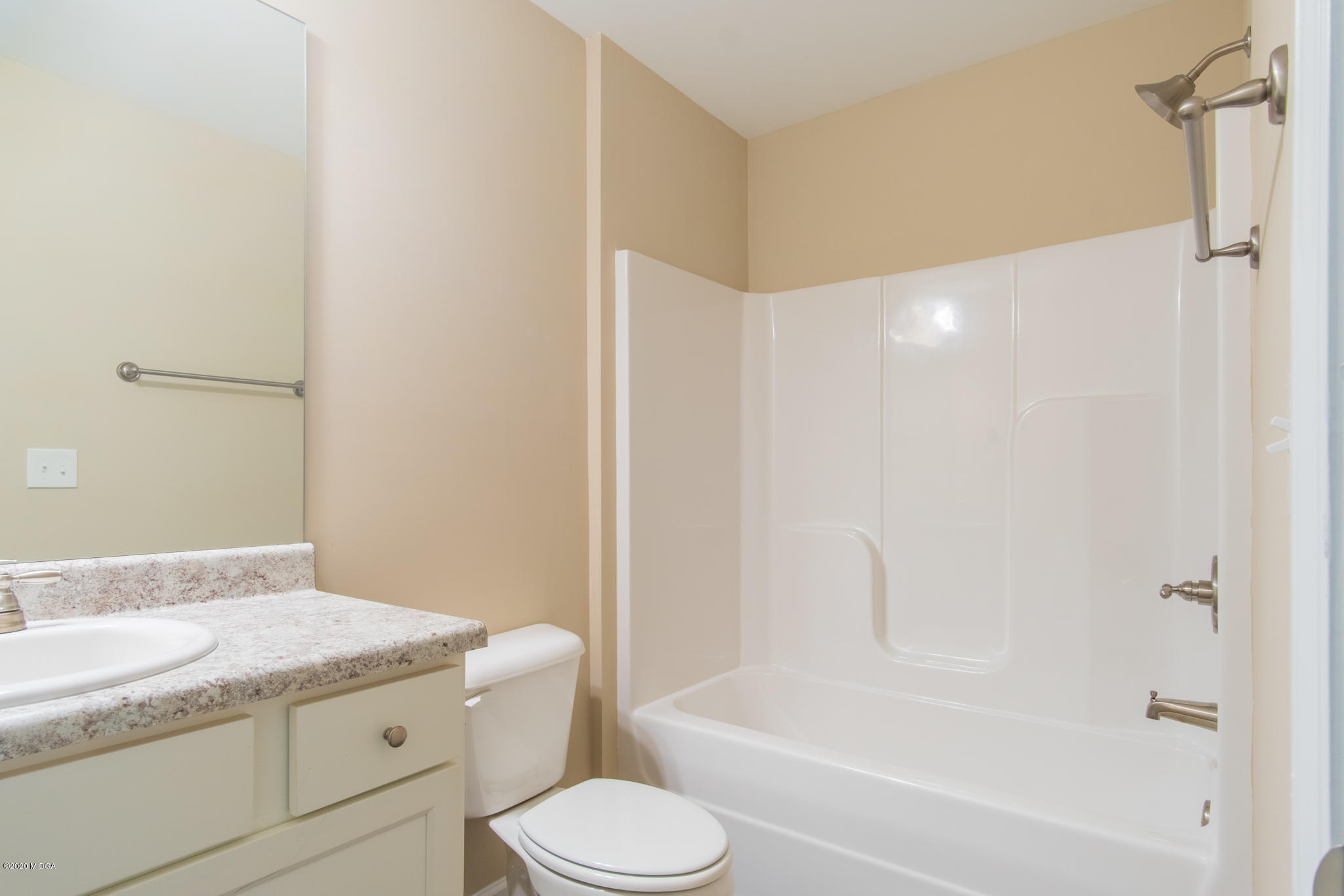 303 Pond View Road Macon, GA 31206 - Photo 15 of 33 a bathroom with a granite countertop sink toilet and shower