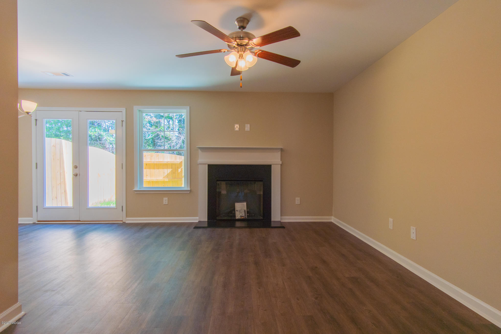 303 Pond View Road Macon, GA 31206 - Photo 4 of 33 wooden floor in an empty room with a window