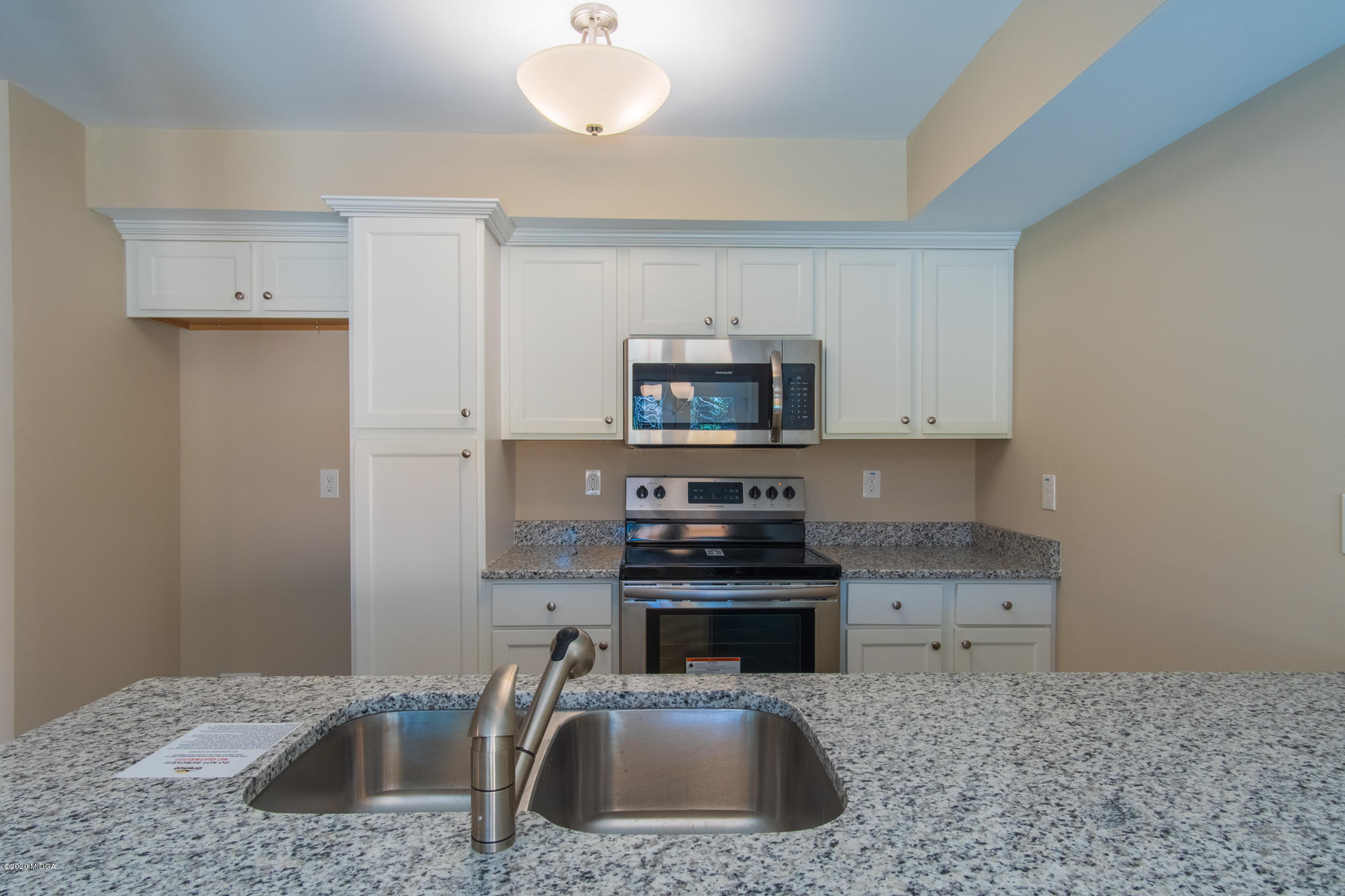 303 Pond View Road Macon, GA 31206 - Photo 8 of 33 a kitchen with a sink a stove and cabinets