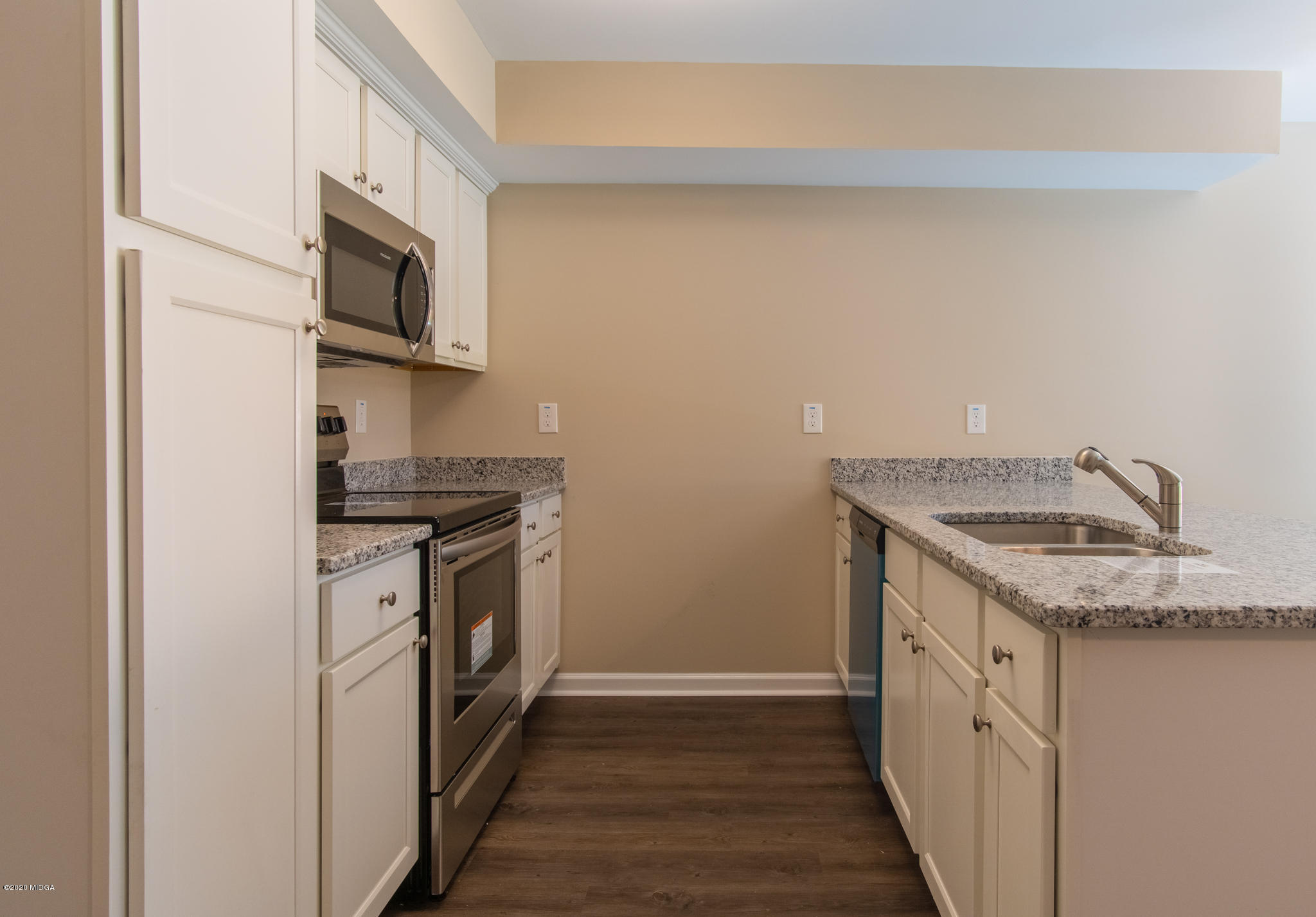 303 Pond View Road Macon, GA 31206 - Photo 9 of 33 a kitchen with stainless steel appliances granite countertop a sink and a stove top oven