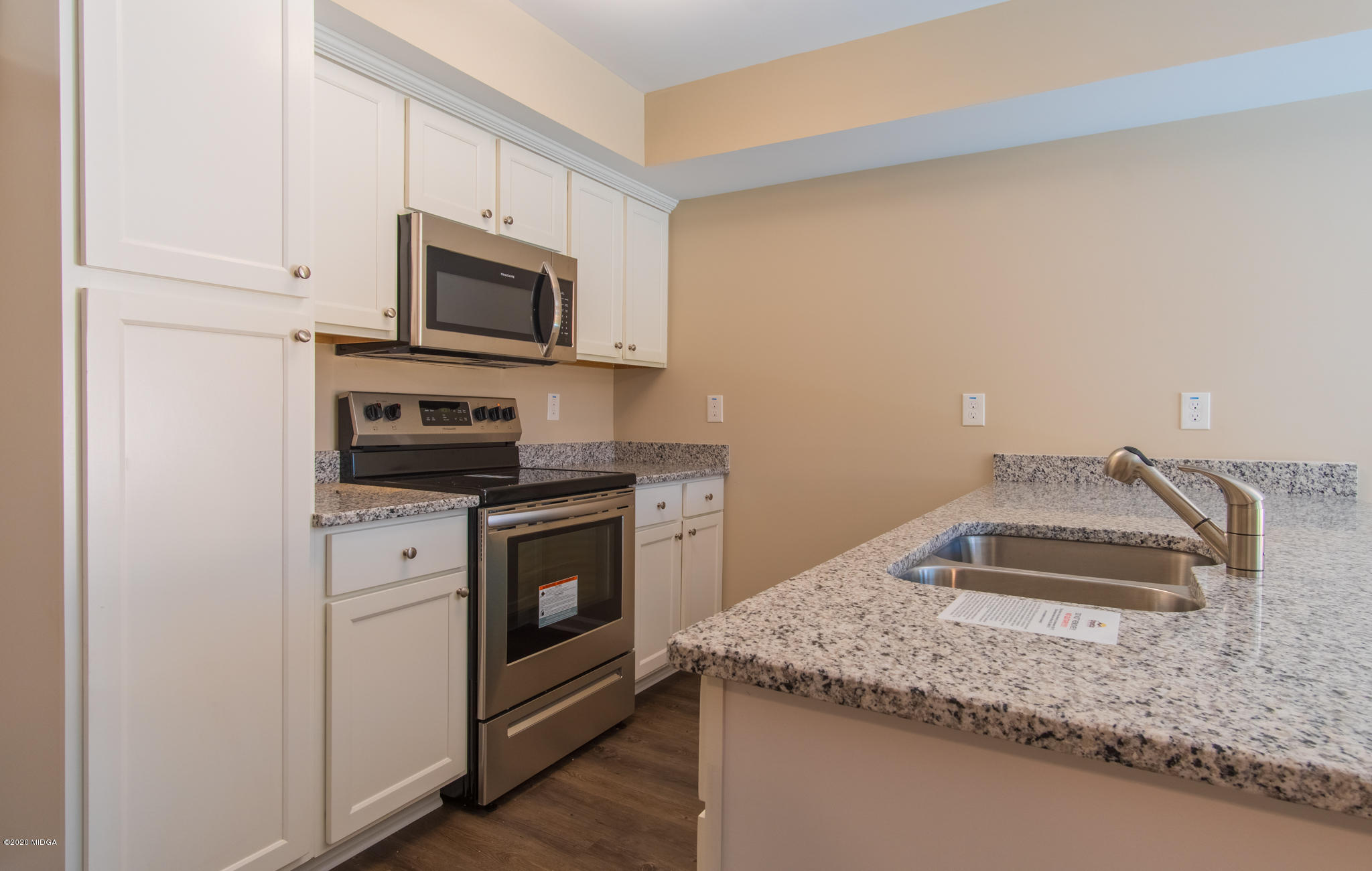 303 Pond View Road Macon, GA 31206 - Photo 10 of 33 a kitchen with stainless steel appliances granite countertop a sink stove and microwave