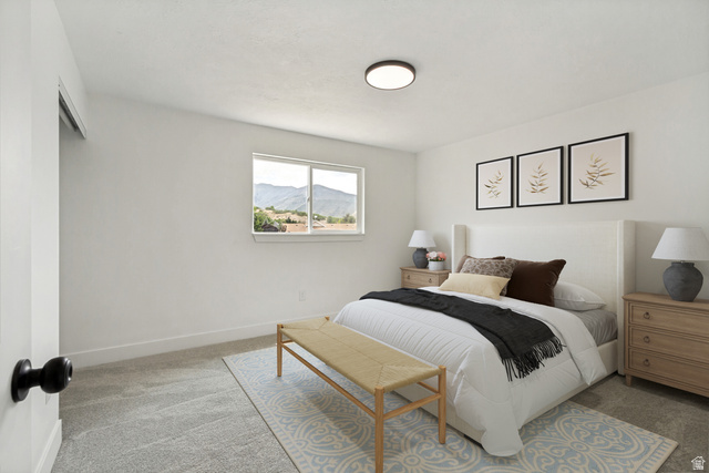 62 South Clark Lane Elk Ridge, UT 84651 - Photo 12 of 30 Primary Bedroom with a window, baseboard trim, and a ceiling light fixture. Jack and Jill Bathroom attached.