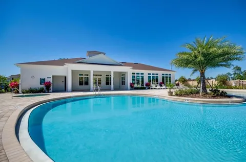 a view of pool with outdoor seating