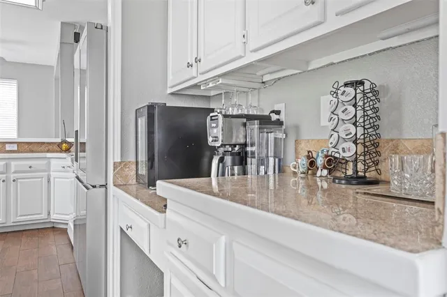 a kitchen with sink cabinets and outdoor view