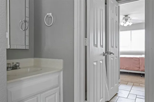 a bathroom with a tub sink and shower