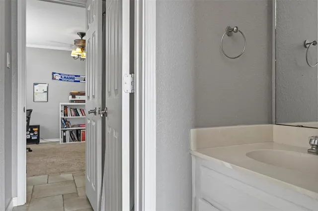 a bathroom with a tub and a sink
