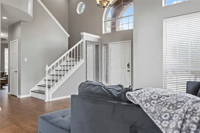 a bedroom with bed and a window