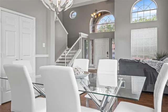 a living room with furniture and a clock