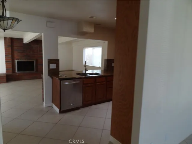 a stove top oven sitting inside of a kitchen