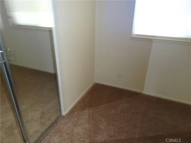 a bathroom with a bathtub and window