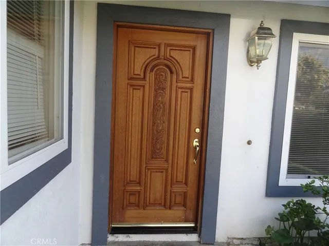 a view of front door with a mirror