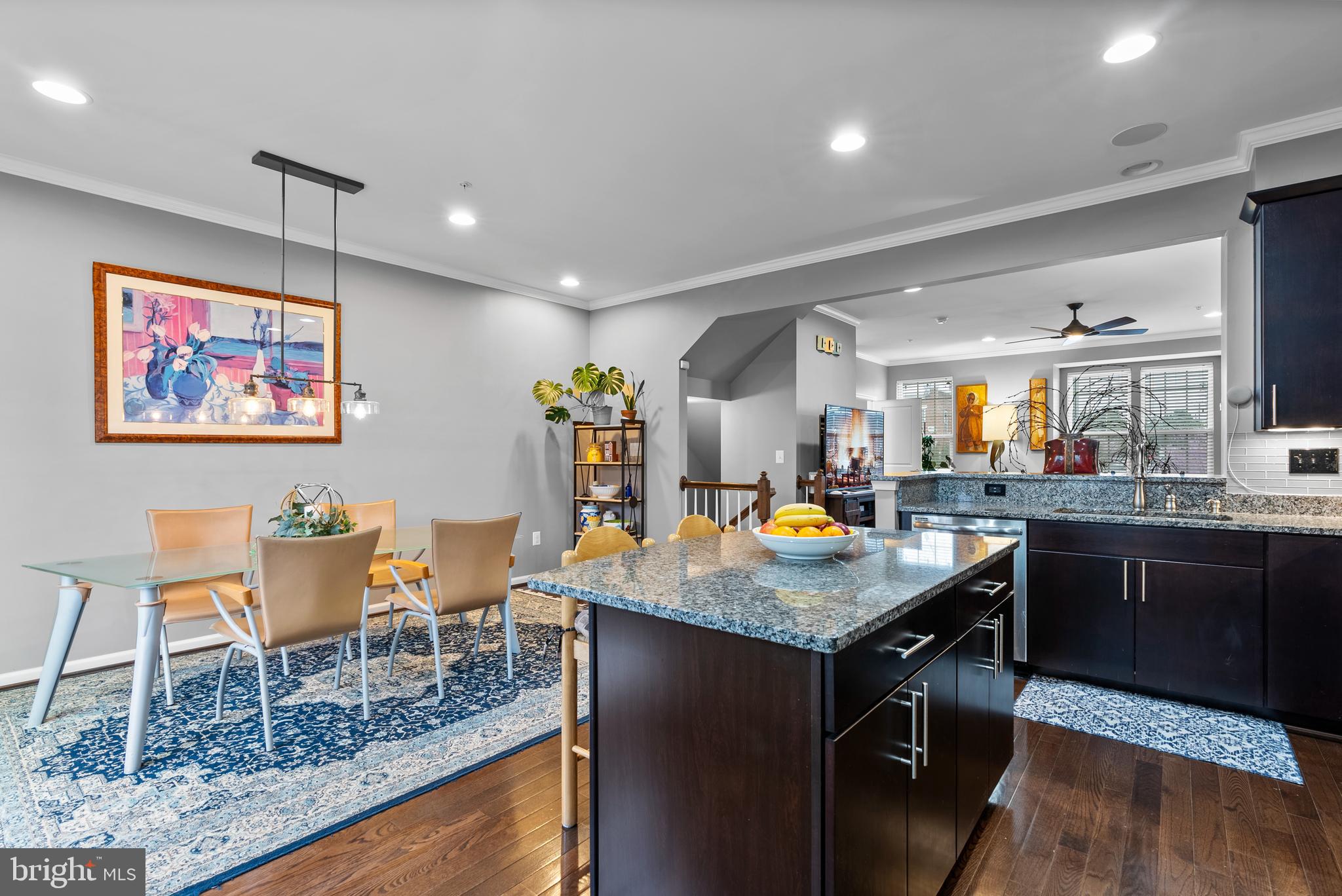 834 Oldham Street Baltimore, MD 21224 - Photo 14 of 55 a kitchen with stainless steel appliances granite countertop a table chairs and a refrigerator