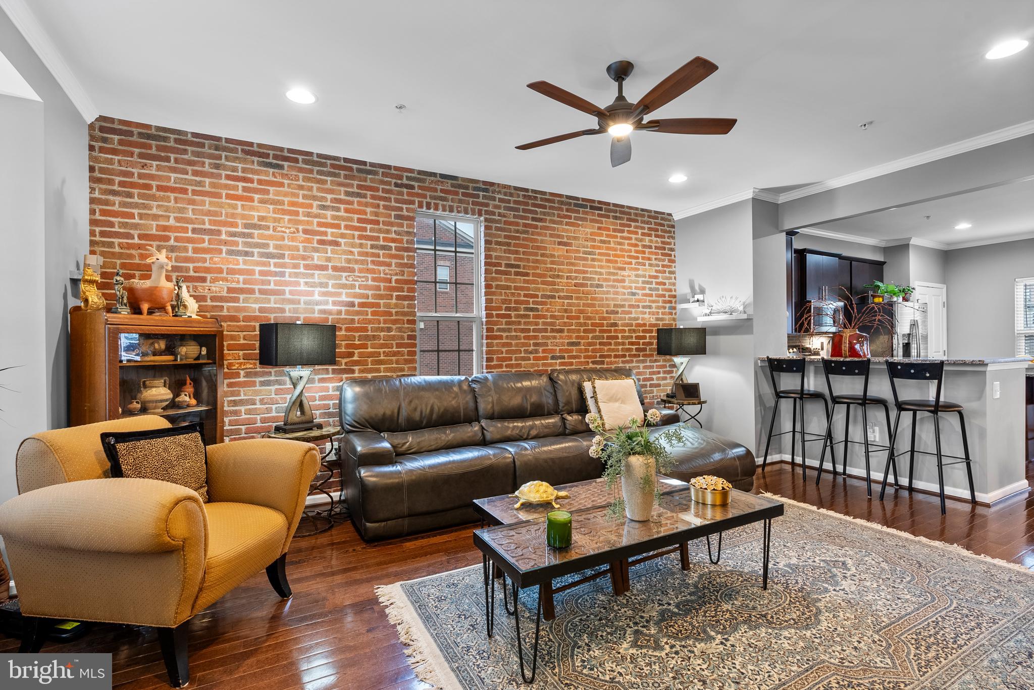834 Oldham Street Baltimore, MD 21224 - Photo 22 of 55 a living room with furniture a table and a ceiling fan
