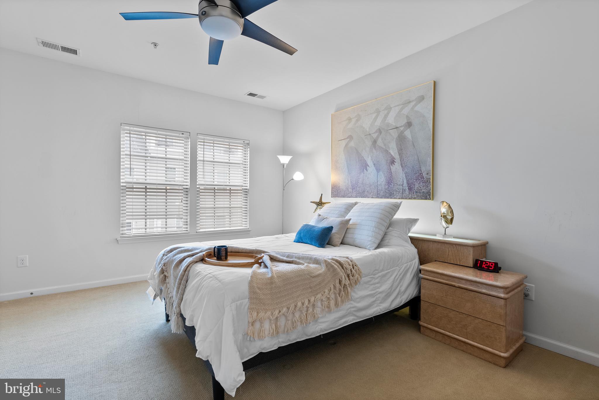 834 Oldham Street Baltimore, MD 21224 - Photo 32 of 55 a bed sitting in a bedroom next to a window