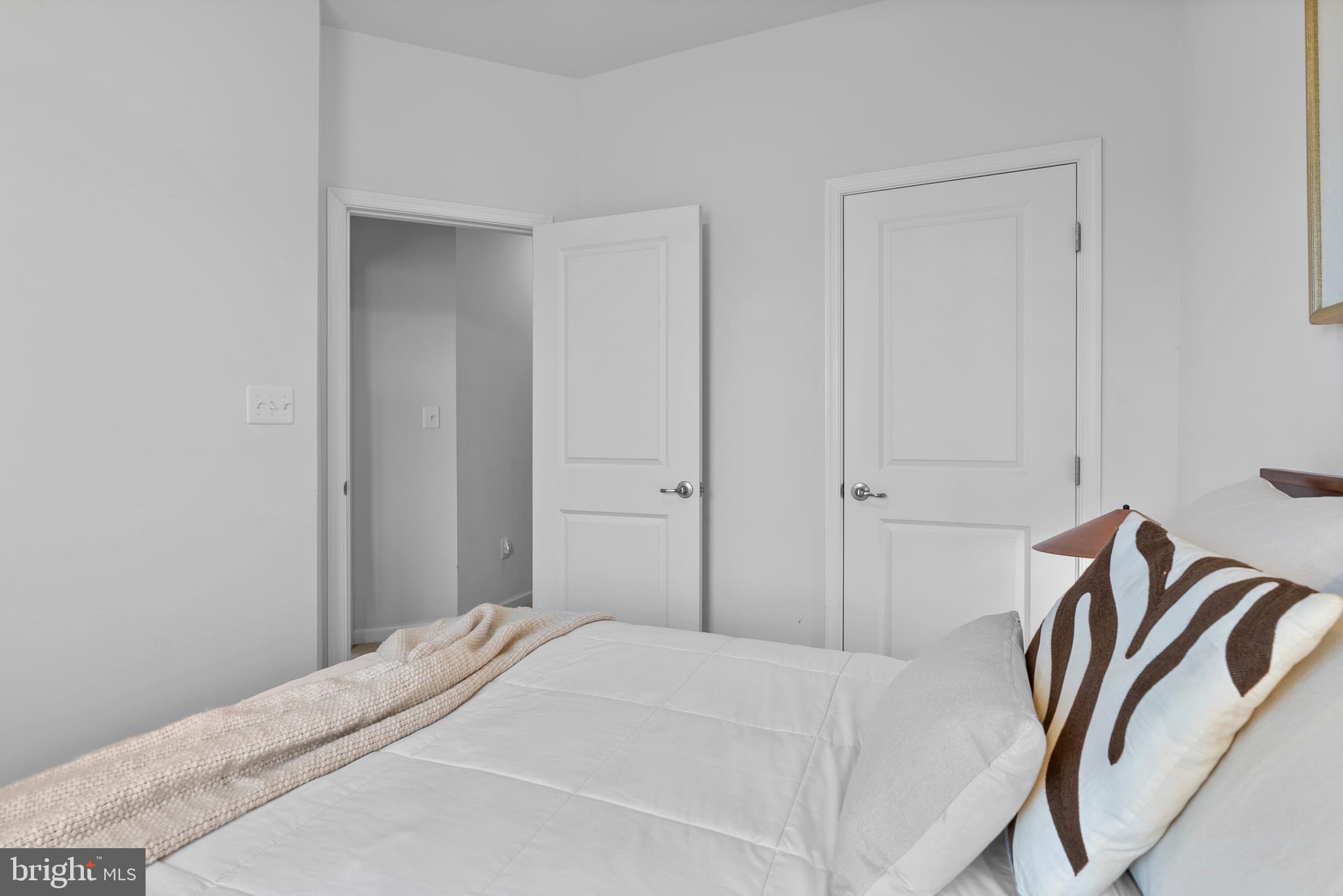 834 Oldham Street Baltimore, MD 21224 - Photo 38 of 55 a bedroom with a bed and a painting on the wall