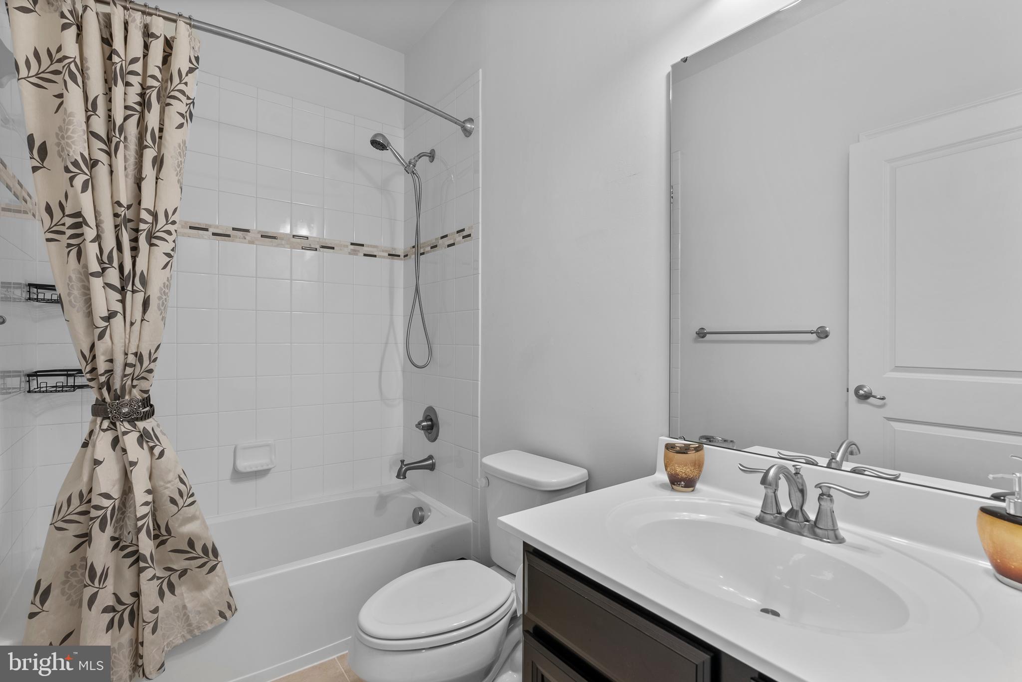 834 Oldham Street Baltimore, MD 21224 - Photo 39 of 55 a bathroom with a sink a toilet and shower