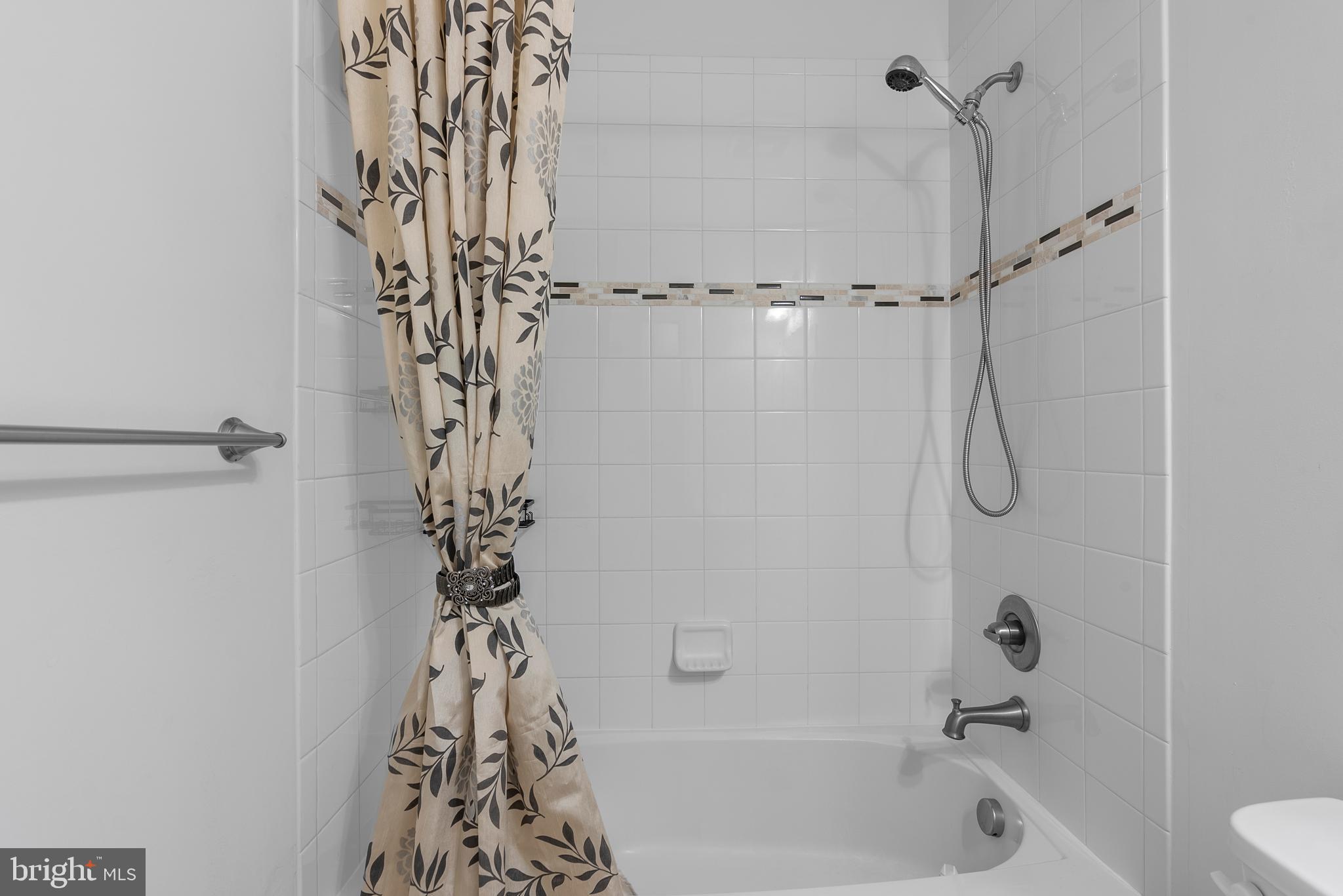 834 Oldham Street Baltimore, MD 21224 - Photo 40 of 55 a bathroom with a shower curtain