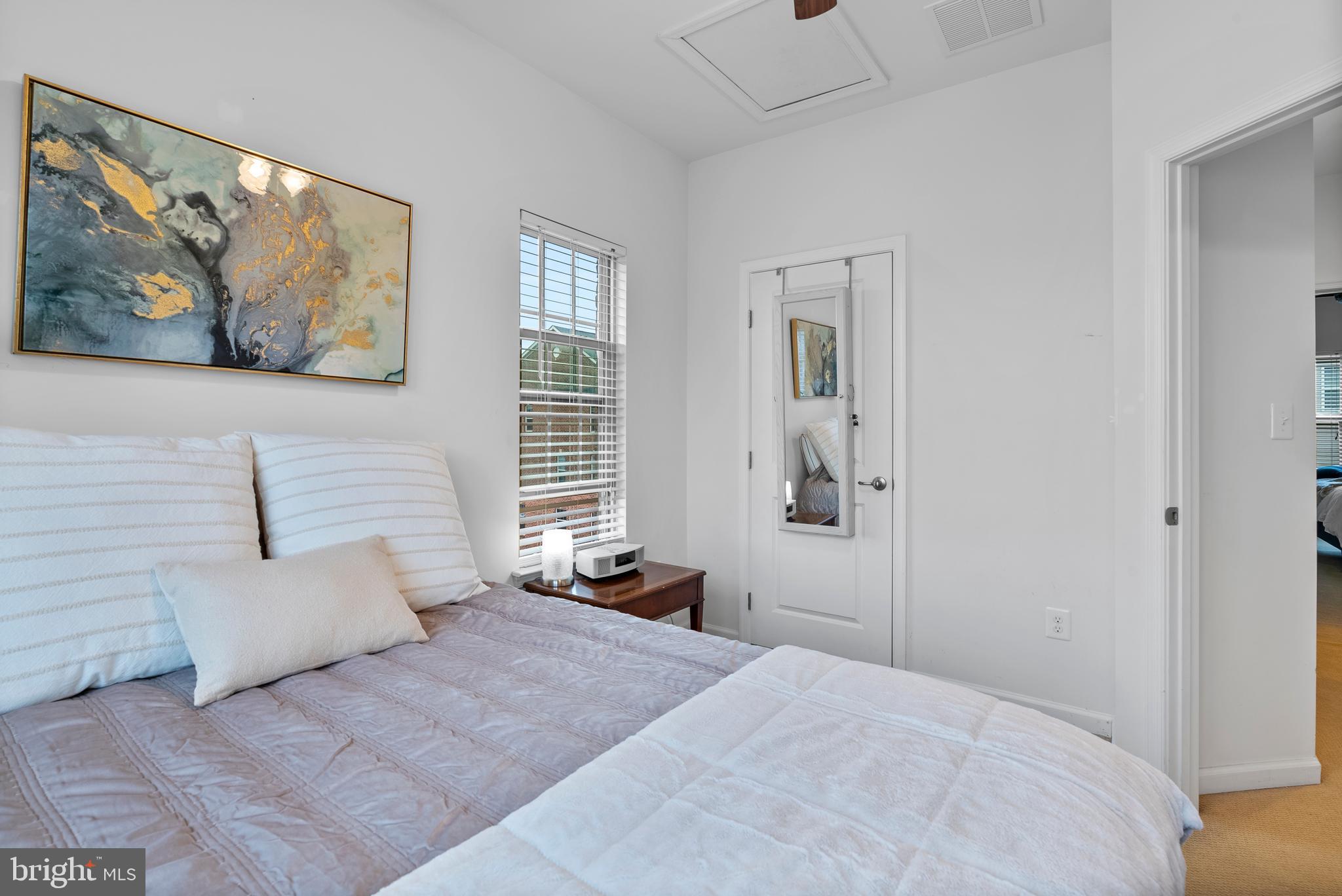 834 Oldham Street Baltimore, MD 21224 - Photo 43 of 55 a bedroom with a bed and a painting on the wall