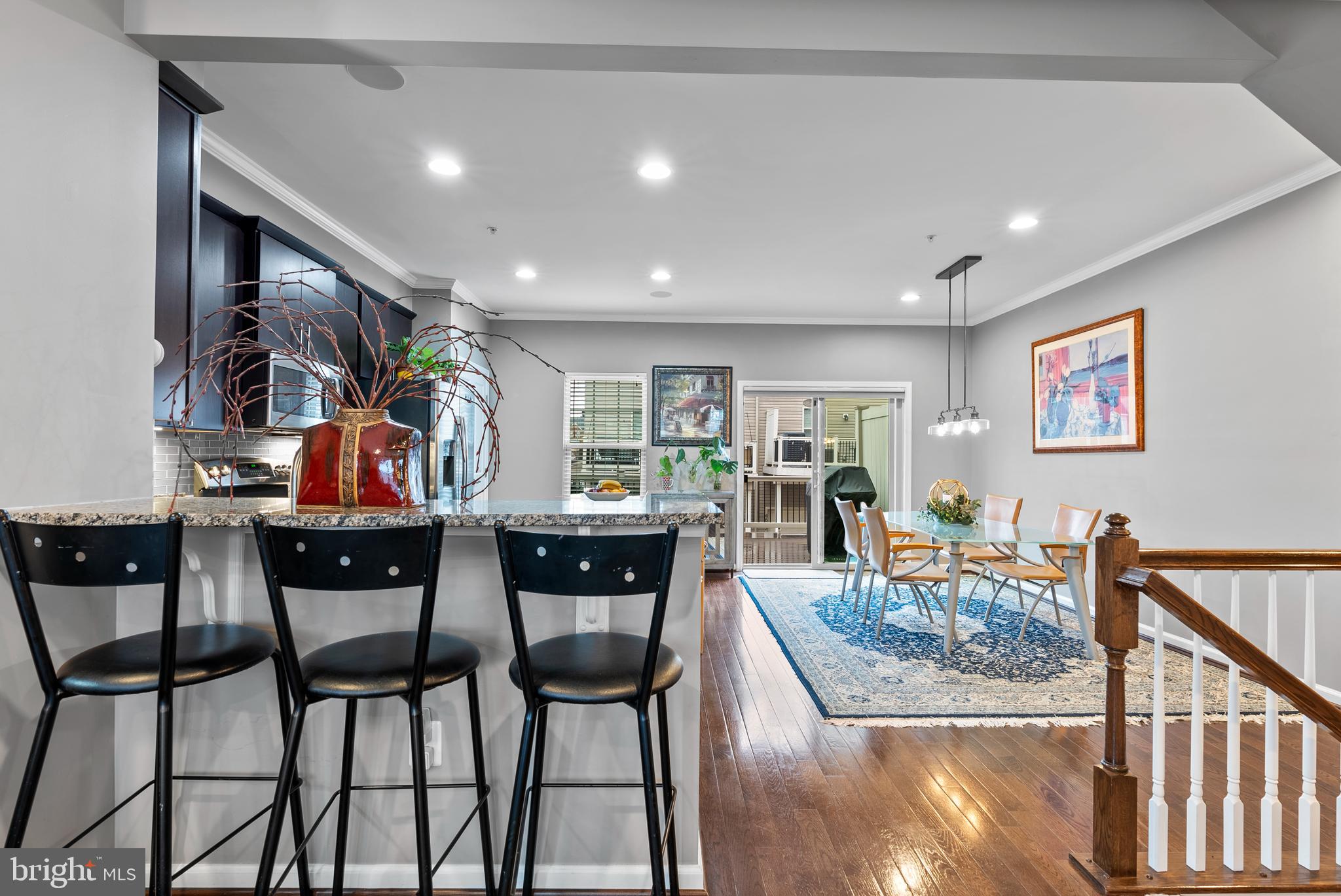 834 Oldham Street Baltimore, MD 21224 - Photo 10 of 55 a view of a dining room with furniture one side kitchen view and wooden floor