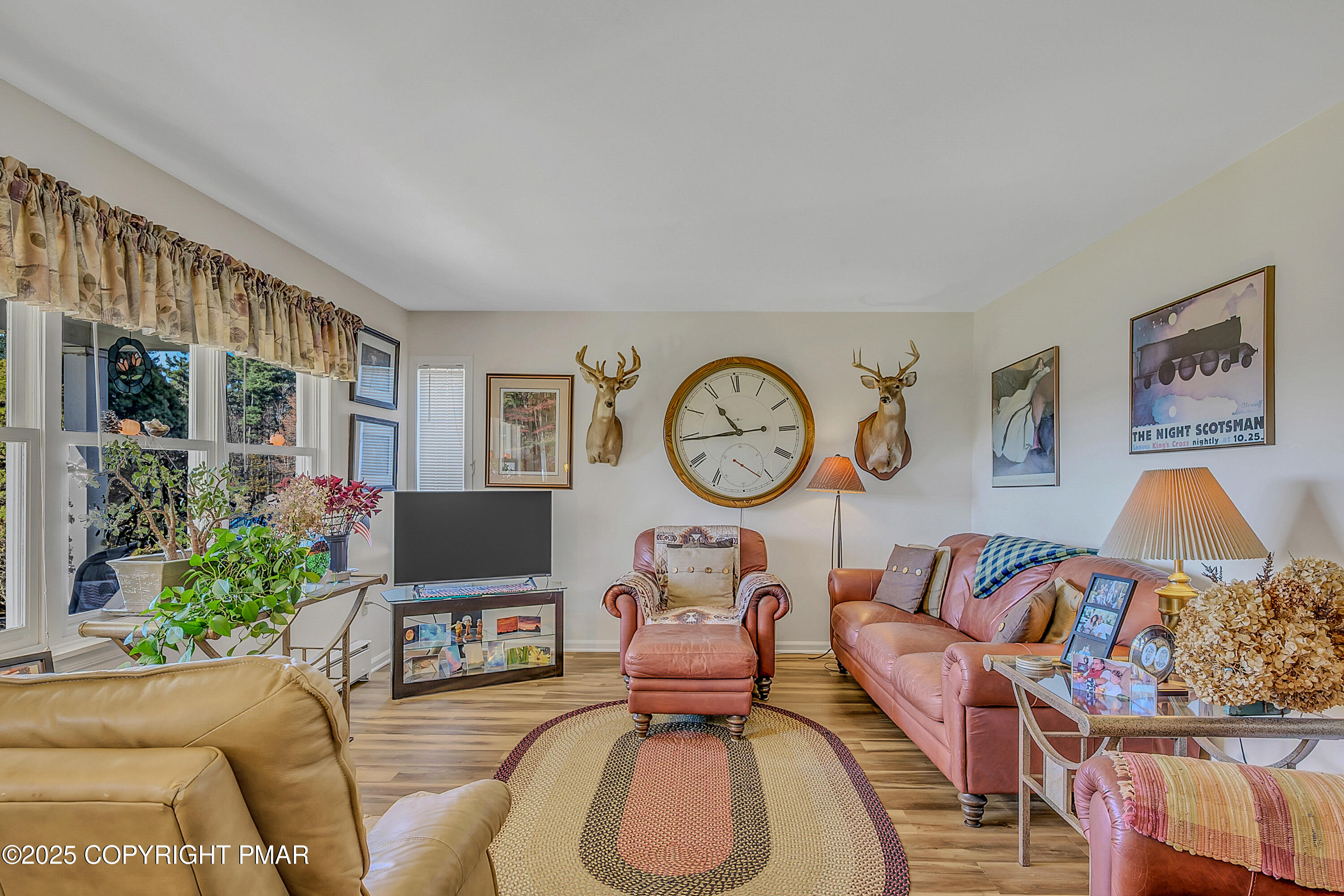1451 Long Pond Road Long Pond, PA 18334 - Photo 39 of 82 a living room with furniture a window and a clock