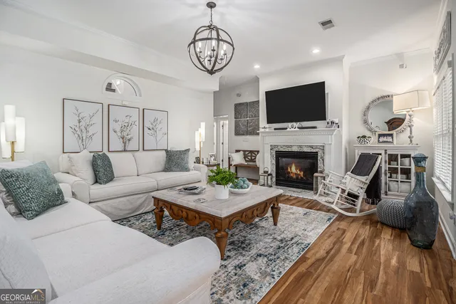 a living room with furniture fireplace and flat screen tv