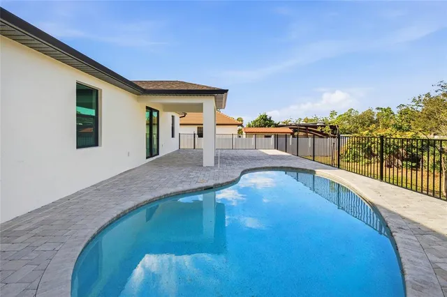 a view of a house with swimming pool