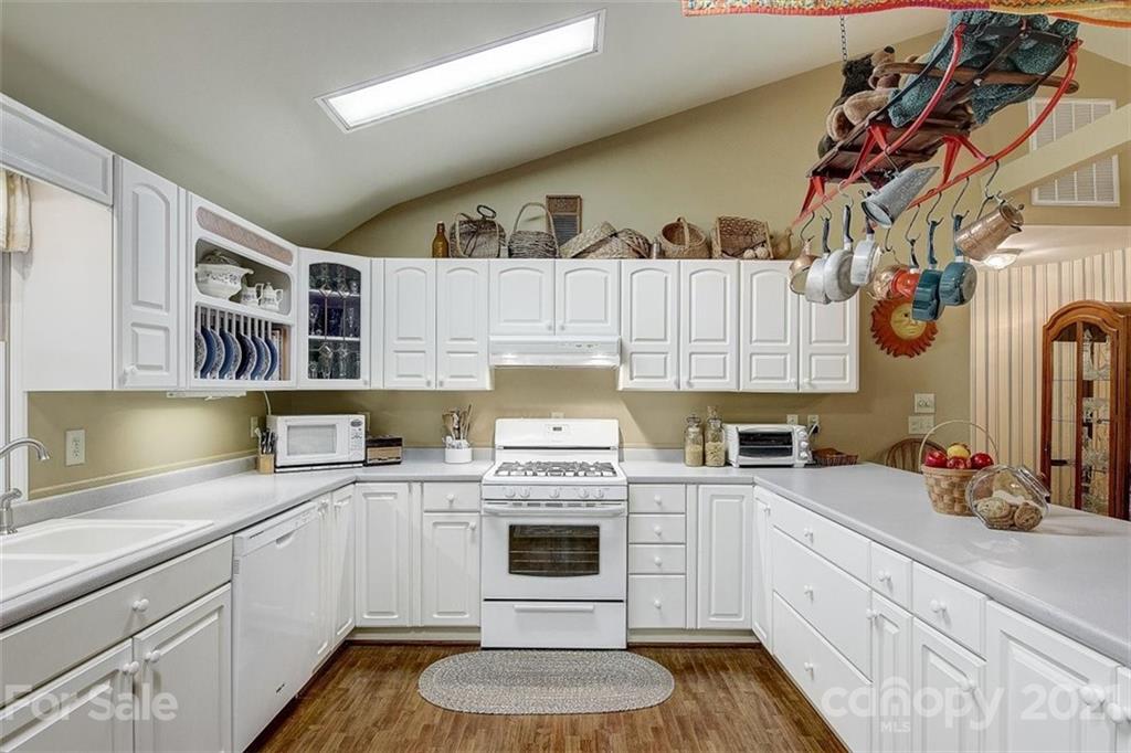 3271 Polk County Line Road Rutherfordton, NC 28139 - Photo 29 of 48 a kitchen with a white cabinets and stove top oven