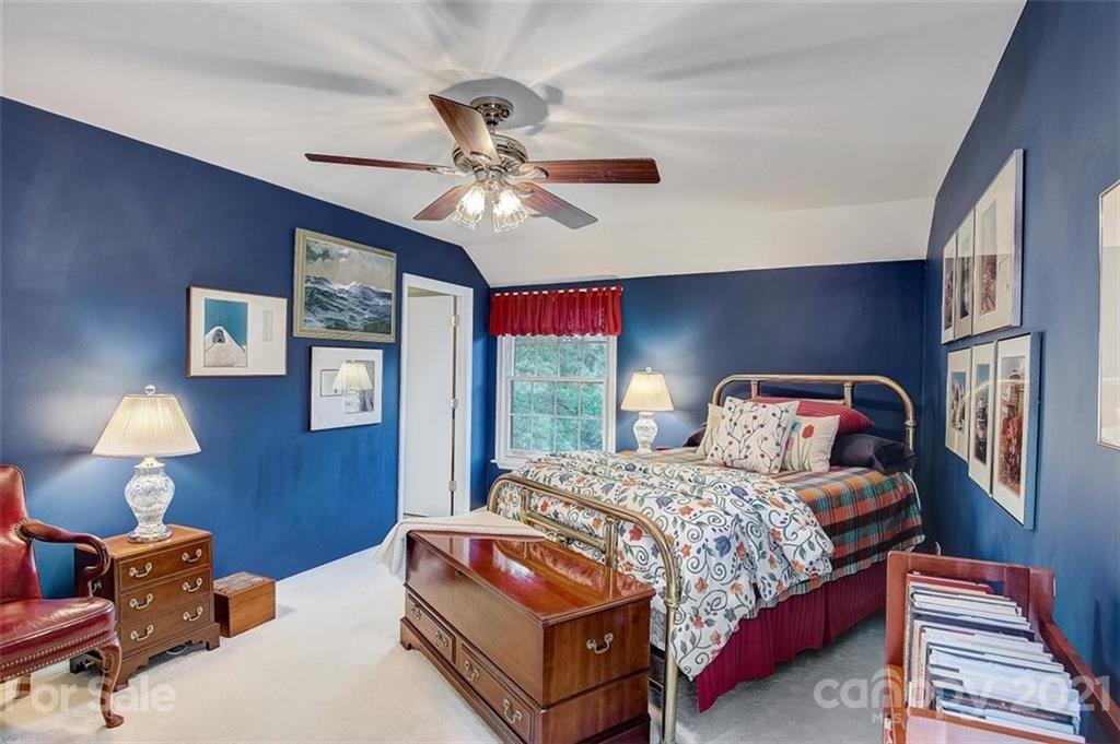 3271 Polk County Line Road Rutherfordton, NC 28139 - Photo 31 of 48 a bedroom with a bed and wooden floor