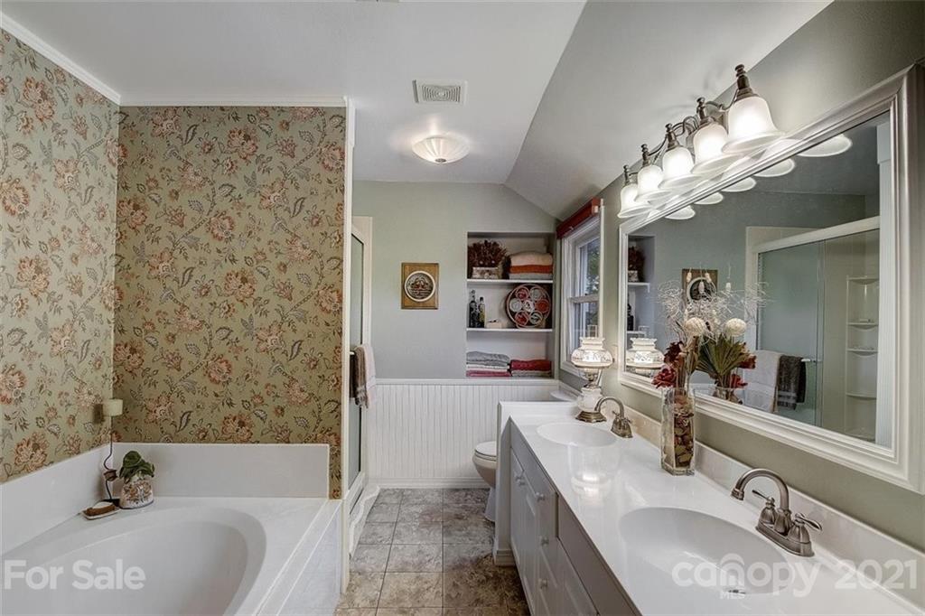 3271 Polk County Line Road Rutherfordton, NC 28139 - Photo 33 of 48 a bathroom with a tub sink and mirror