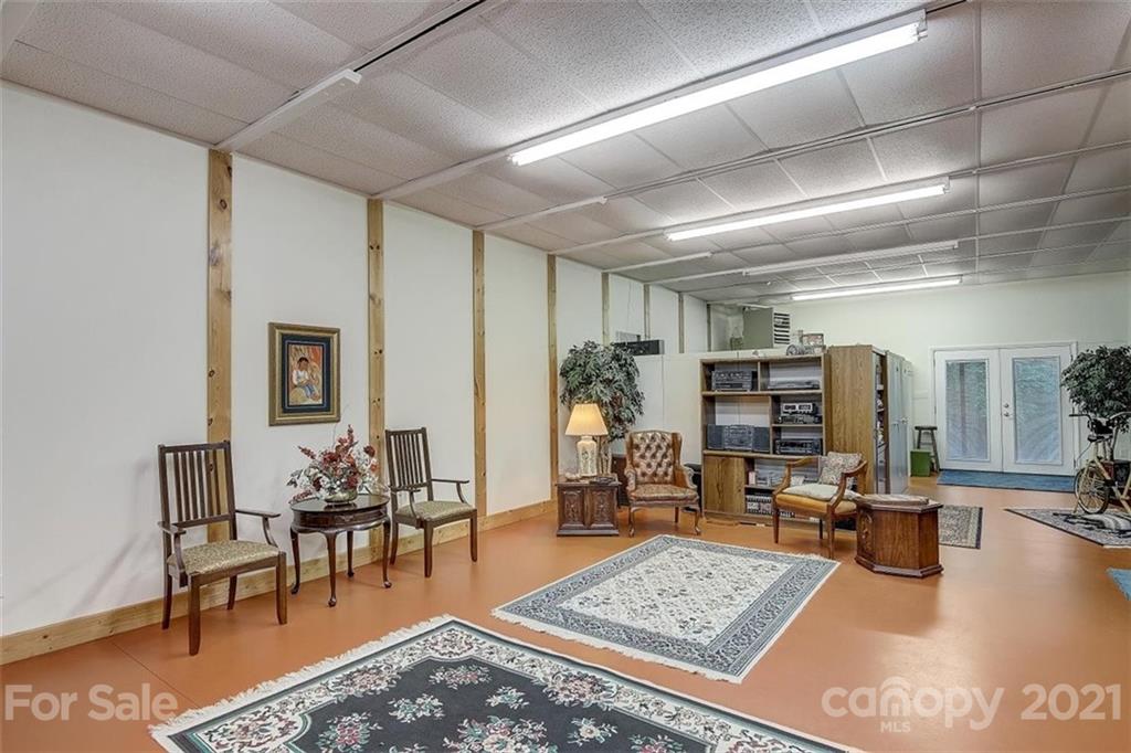 3271 Polk County Line Road Rutherfordton, NC 28139 - Photo 41 of 48 a living room with lots of furniture and rug