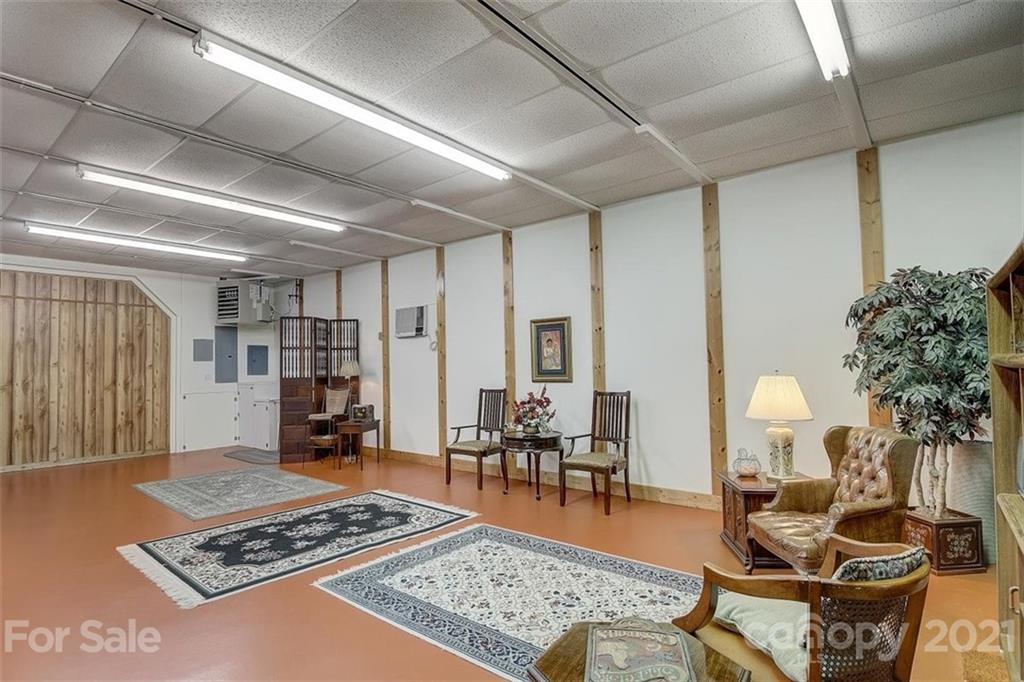 3271 Polk County Line Road Rutherfordton, NC 28139 - Photo 42 of 48 a living room with furniture and a lamp