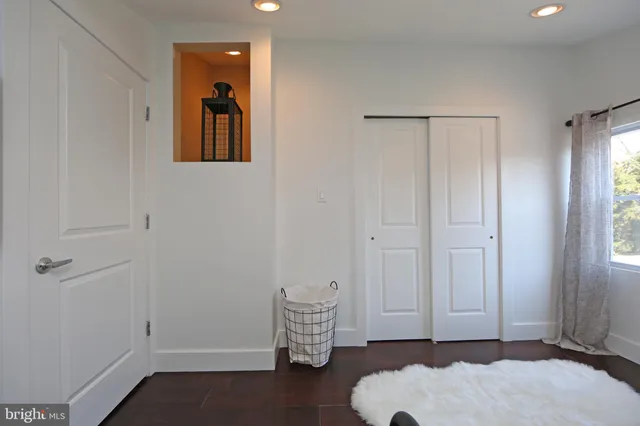 a bathroom with a sink a mirror a vanity and a shower