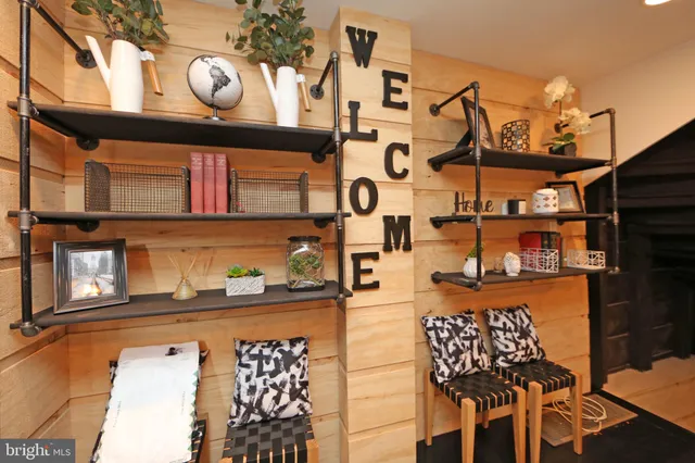 a bedroom with furniture and a flat screen tv