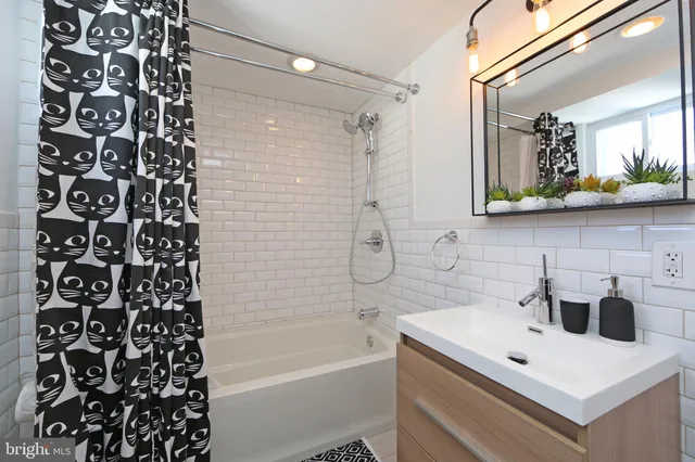 a bathroom with a shower and a bathtub